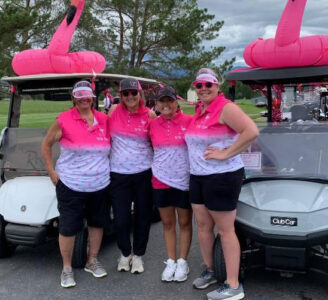 Group of four golfers at a Pack the Place in Pink Golf Tournament