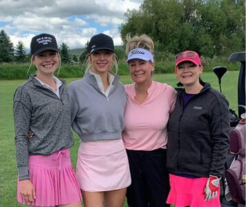 Group of four golfers at a Pack the Place in Pink golf tournament